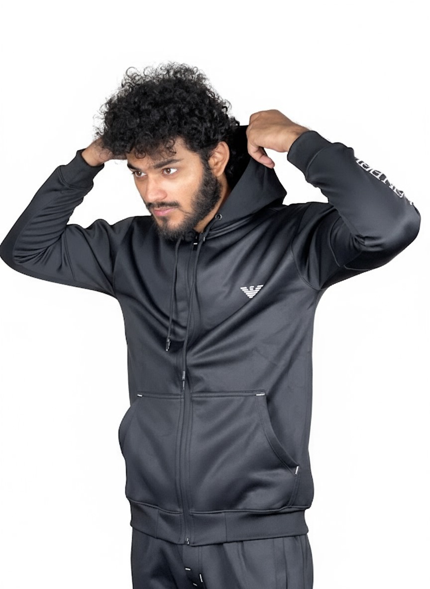 A man in black track suit